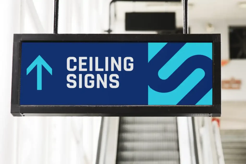 Wayfinding ceiling signs pointing upstairs